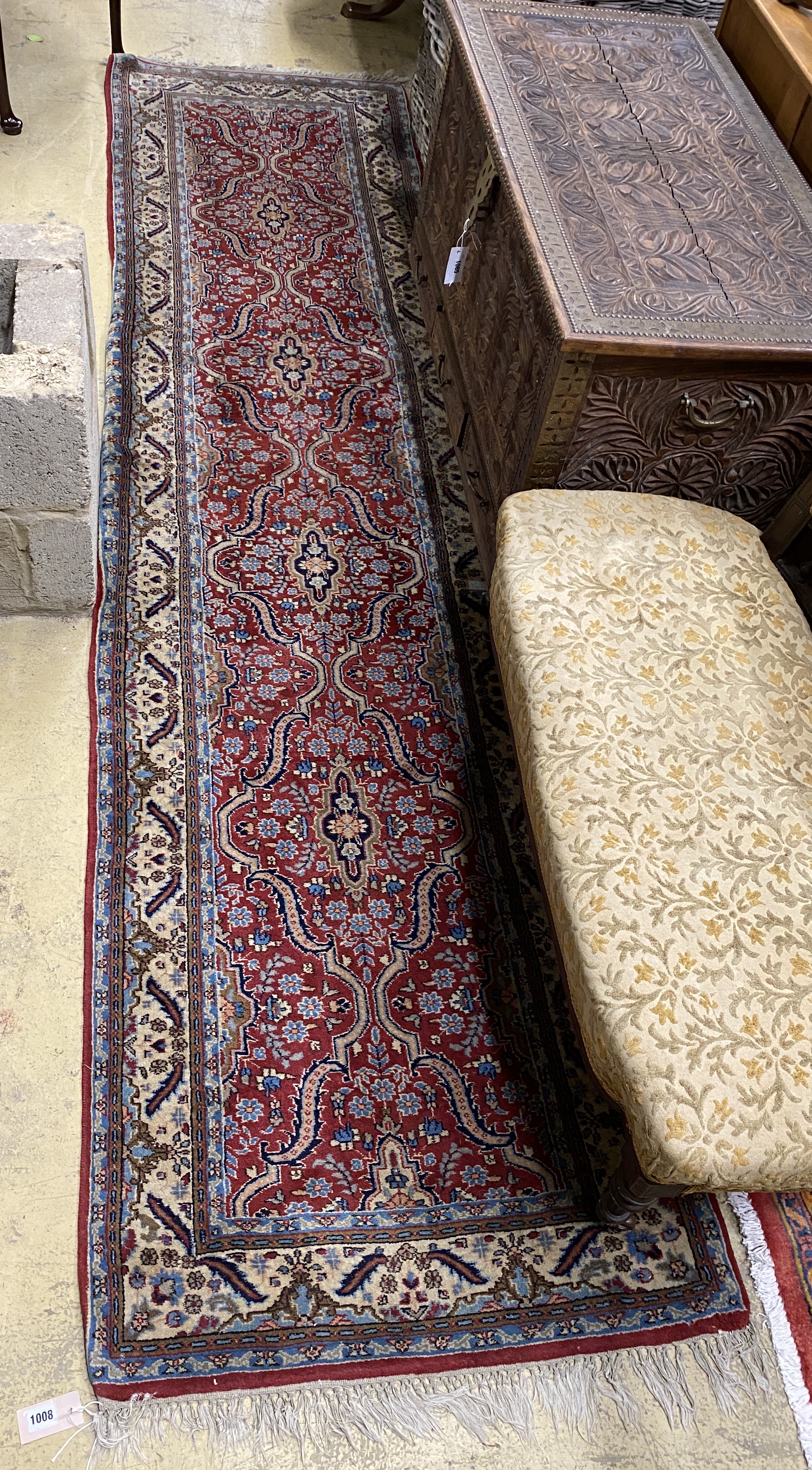 A North West Persian red ground runner, 322 x 79cm